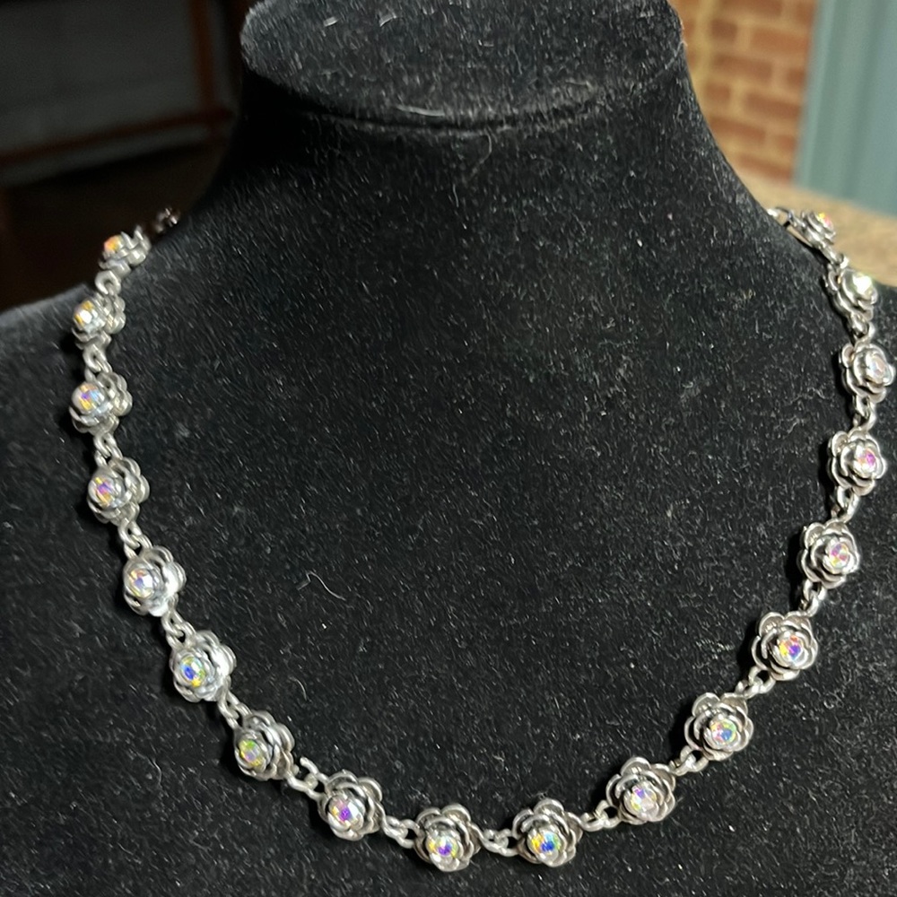 P D design silver tone necklace